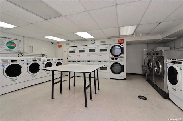 clothes washing area featuring washing machine and dryer and stacked washer / drying machine