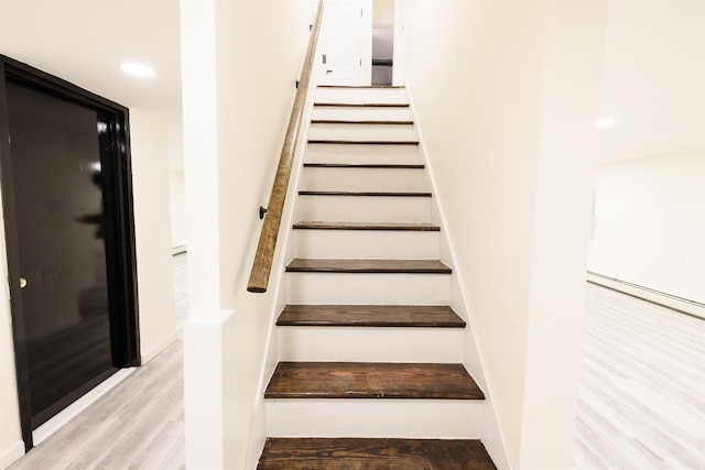 stairway with wood-type flooring