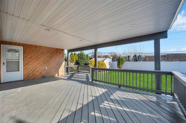 wooden terrace with a yard