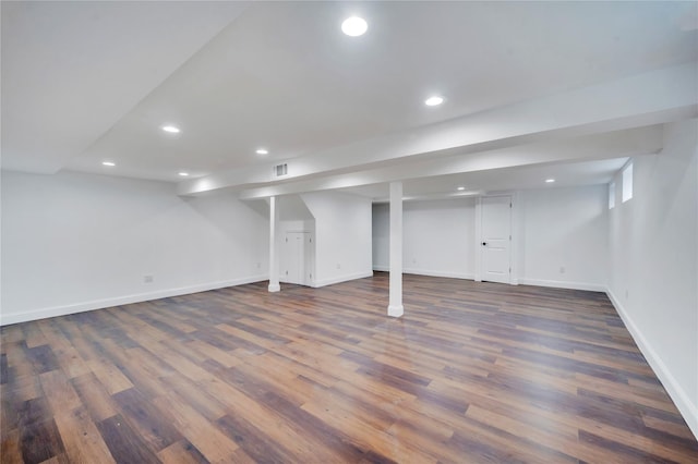 basement featuring dark hardwood / wood-style flooring