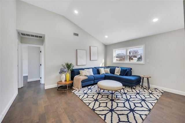 living room featuring vaulted ceiling and dark wood-type flooring