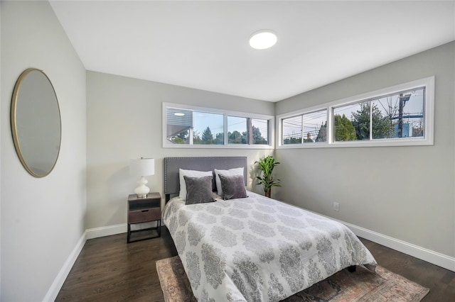 bedroom featuring dark hardwood / wood-style flooring