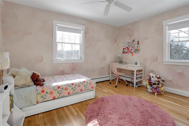 bedroom featuring wood-type flooring and ceiling fan