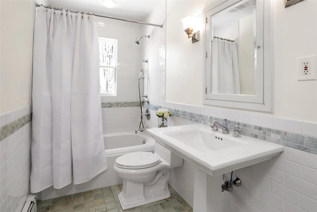 bathroom with baseboard heating, shower / bathtub combination with curtain, toilet, and tile walls