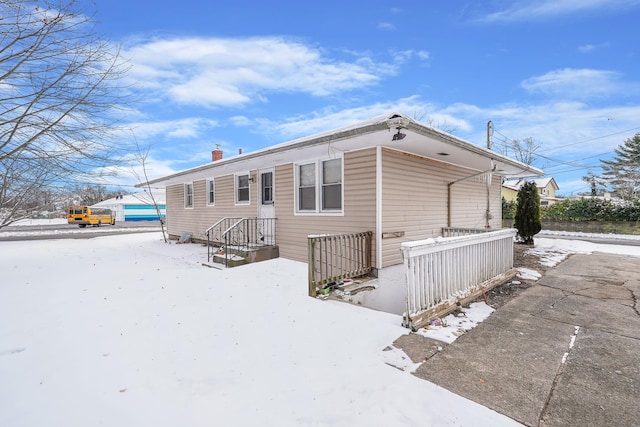 view of snow covered house