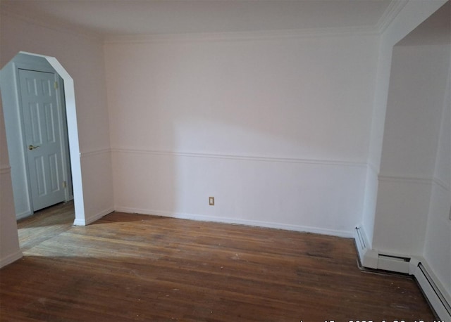 unfurnished room with ornamental molding and dark hardwood / wood-style flooring