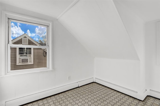 bonus room featuring baseboard heating and vaulted ceiling