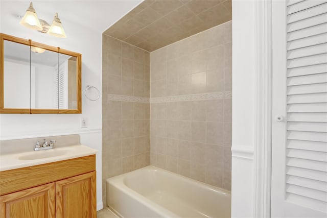 bathroom featuring vanity and tiled shower / bath combo