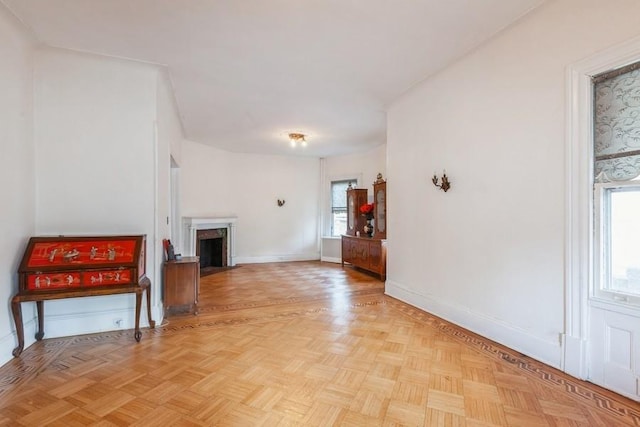 unfurnished living room featuring light parquet floors