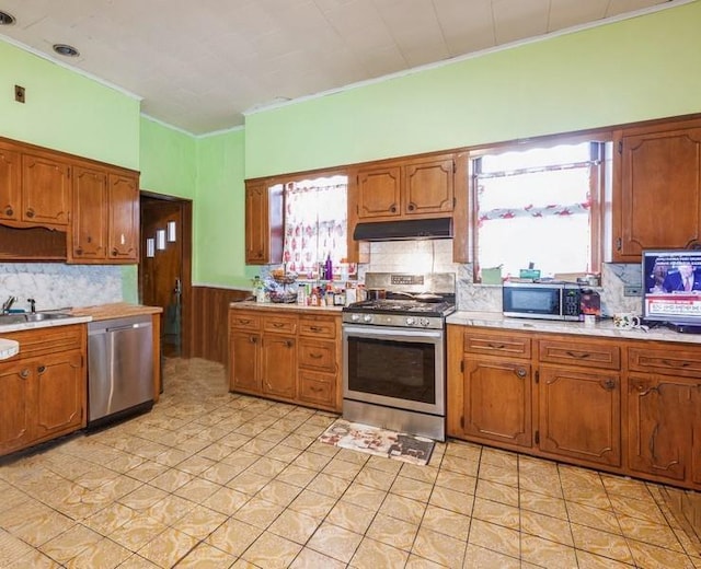 kitchen featuring decorative backsplash, sink, and appliances with stainless steel finishes