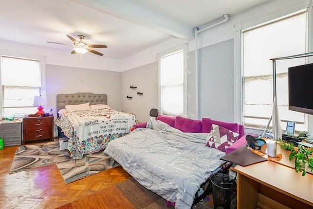 bedroom with parquet floors and ceiling fan