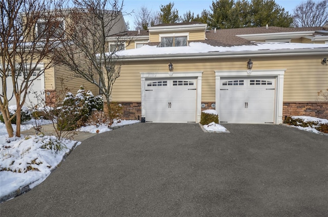 view of snow covered garage