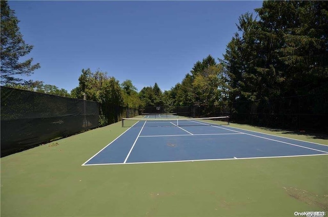 view of tennis court featuring basketball court