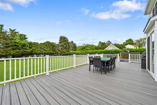 wooden terrace with a yard