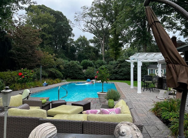 view of swimming pool featuring an outdoor living space, a patio area, and a pergola