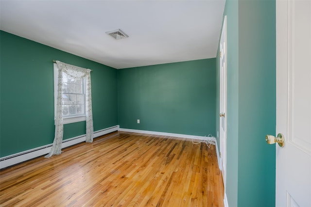 unfurnished room with light hardwood / wood-style floors