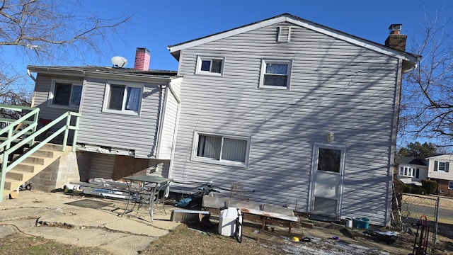 rear view of property featuring a patio area