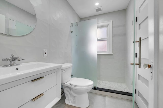 bathroom with vanity, an enclosed shower, and toilet