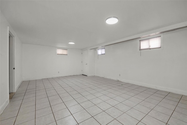 basement with light tile patterned flooring