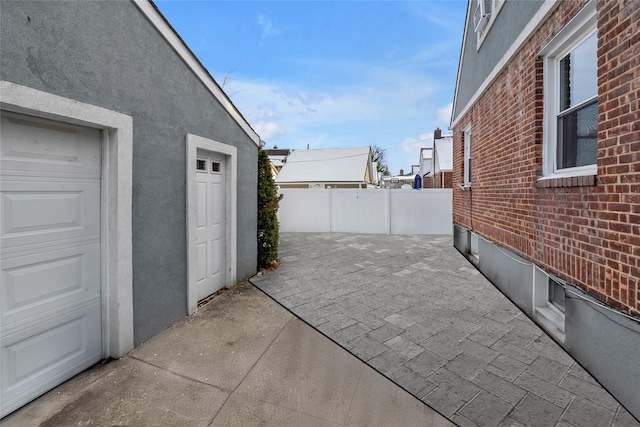 view of patio / terrace featuring a garage