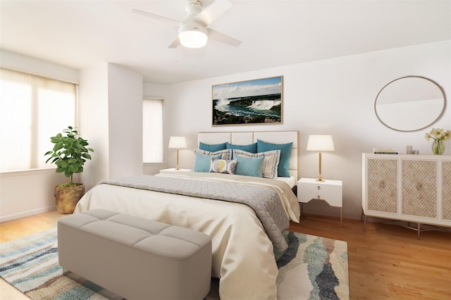 bedroom featuring light hardwood / wood-style floors and ceiling fan