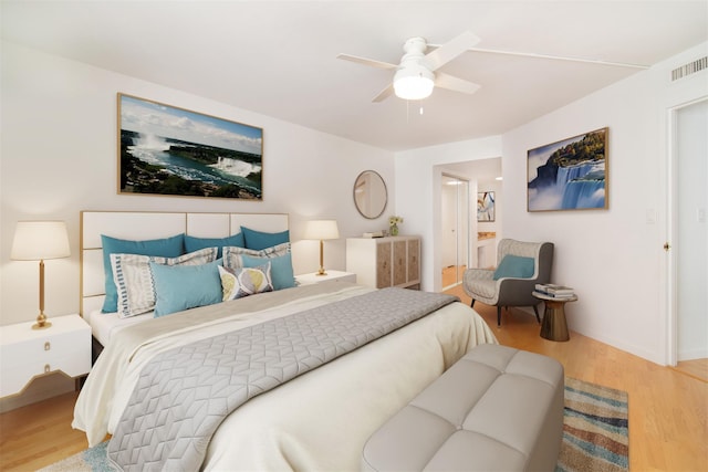 bedroom featuring hardwood / wood-style flooring and ceiling fan