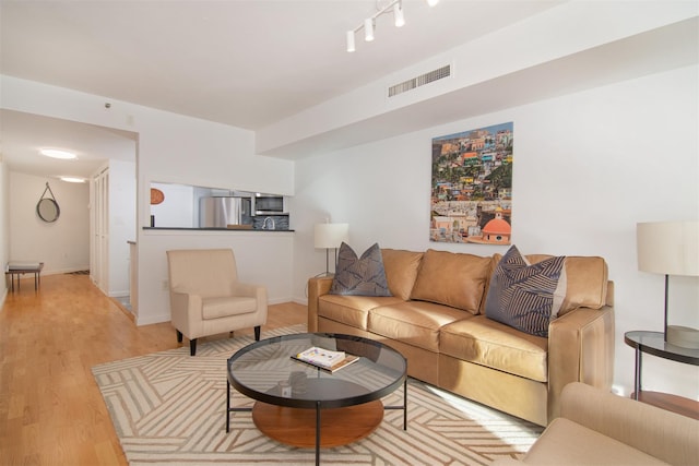 living room with light hardwood / wood-style flooring