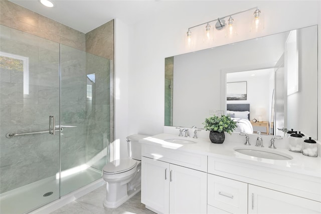 bathroom with vanity, toilet, and an enclosed shower