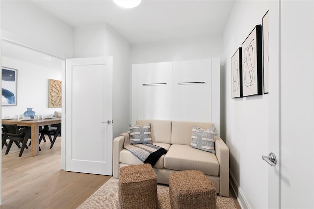 sitting room with light hardwood / wood-style flooring