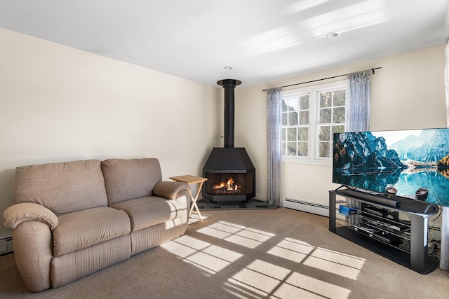 carpeted living room with a baseboard heating unit and a wood stove