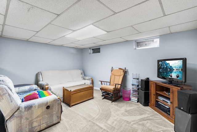 interior space featuring a drop ceiling and carpet flooring