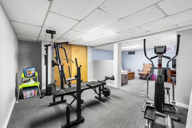 workout room featuring a drop ceiling