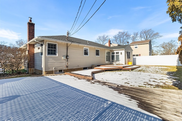 rear view of property with a wooden deck