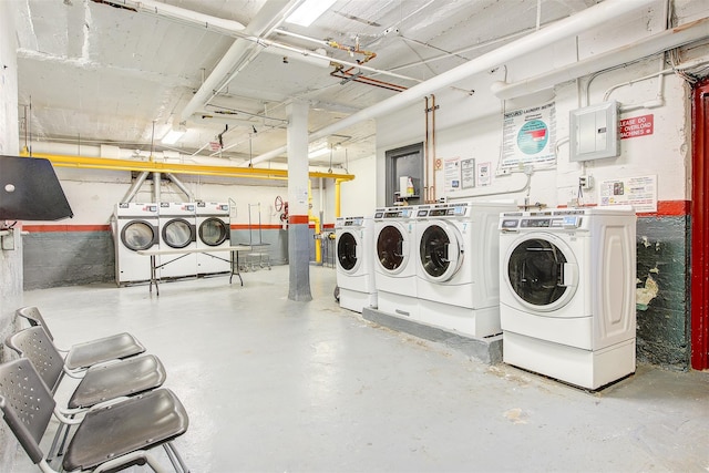 washroom featuring electric panel and separate washer and dryer