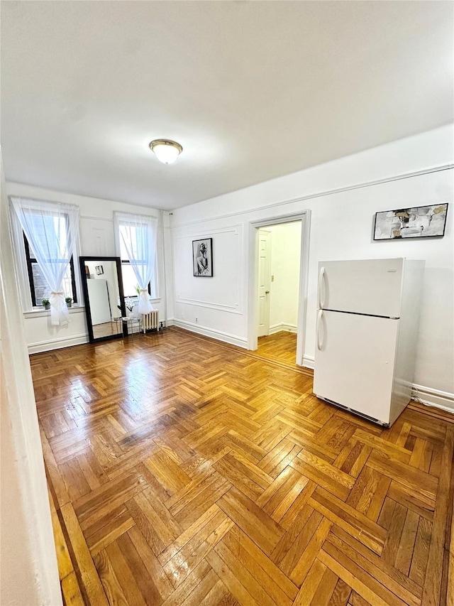 interior space featuring baseboards