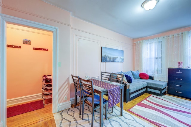 interior space featuring wood finished floors and baseboards