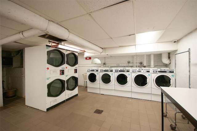 shared laundry area featuring stacked washer and clothes dryer and washer and clothes dryer