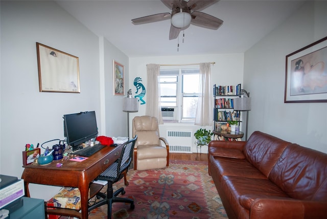 office space with radiator heating unit and ceiling fan