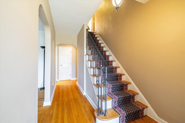 stairway featuring wood-type flooring