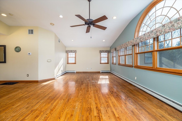 unfurnished living room with baseboard heating, hardwood / wood-style flooring, high vaulted ceiling, and ceiling fan