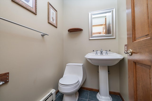 bathroom with toilet and tile patterned floors