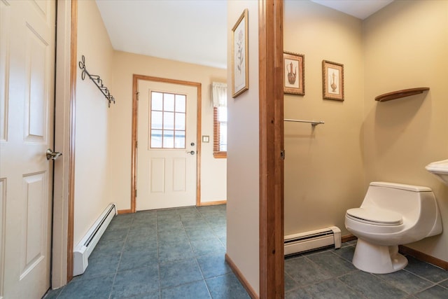 bathroom with a baseboard radiator and toilet