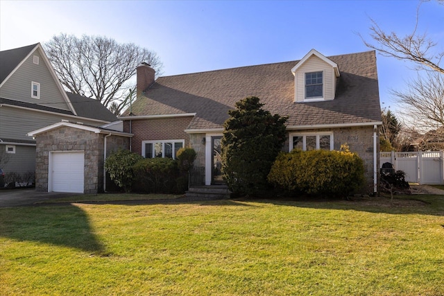 cape cod home featuring a garage and a front yard