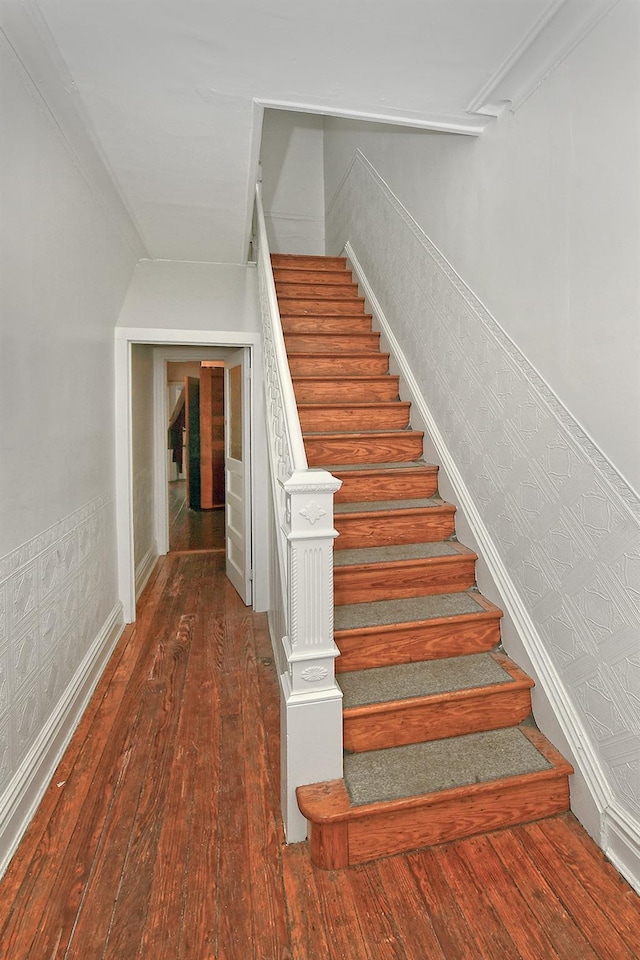 stairway featuring hardwood / wood-style flooring