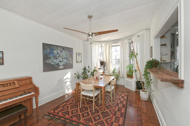 dining room with dark hardwood / wood-style floors and ceiling fan