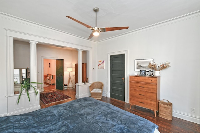 bedroom featuring ceiling fan, ornate columns, dark hardwood / wood-style flooring, and crown molding