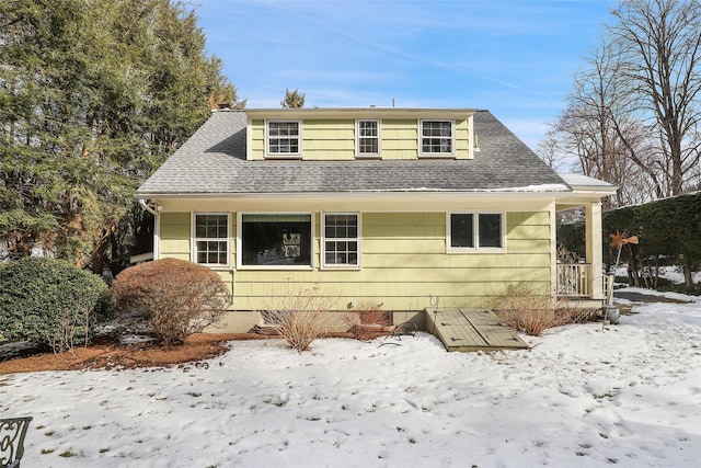 view of snow covered house