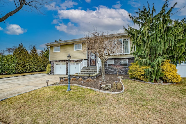 bi-level home featuring a front lawn and a garage