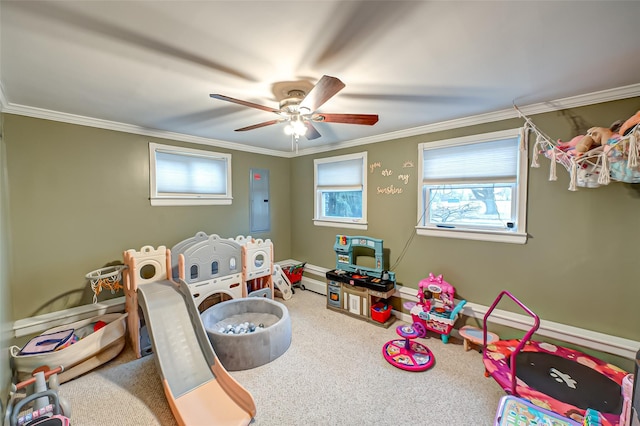 rec room with carpet, electric panel, ornamental molding, and ceiling fan