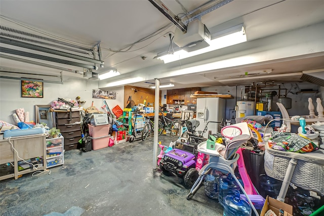 garage with water heater and fridge with ice dispenser